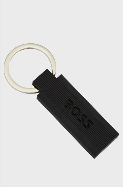 LOGO KEY RING IN BLACK SILICONE AND BRASS